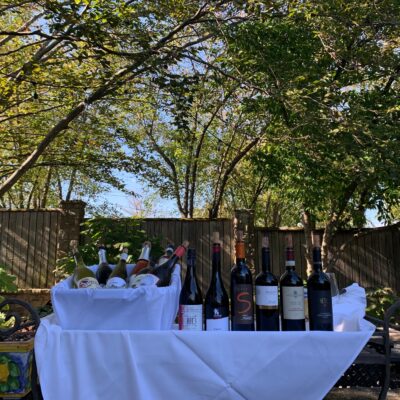 Red and White wines displayed outdoors in the shade