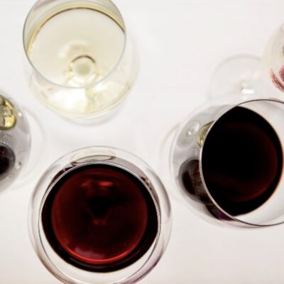 Red, white, and sparkling winne glasses from above