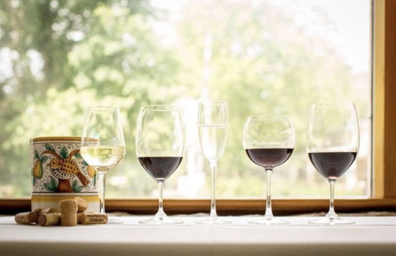 Wine glasses in front of window