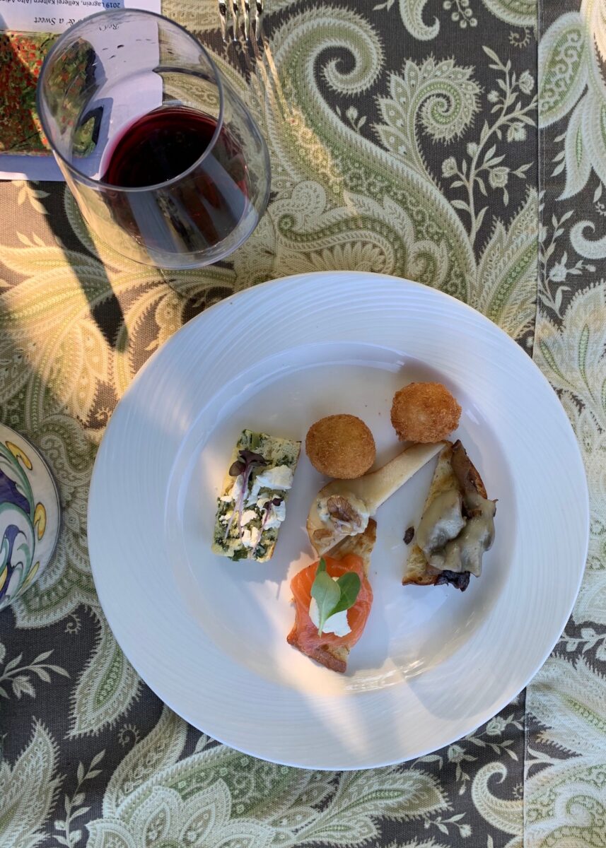 Mixed appetizers with a glass of wine