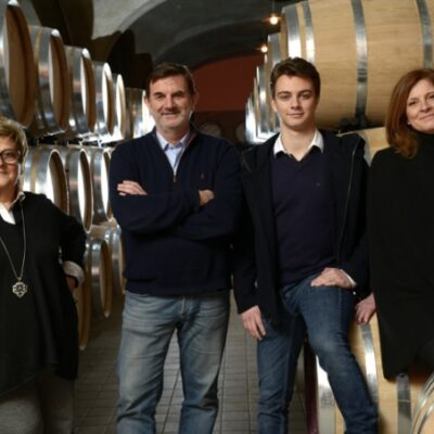 Rita Tua and her family in the wine cellar