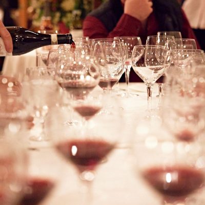 Server pouring wine for a wine tasting event