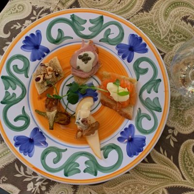 Mixed appetizers with a glass of wine