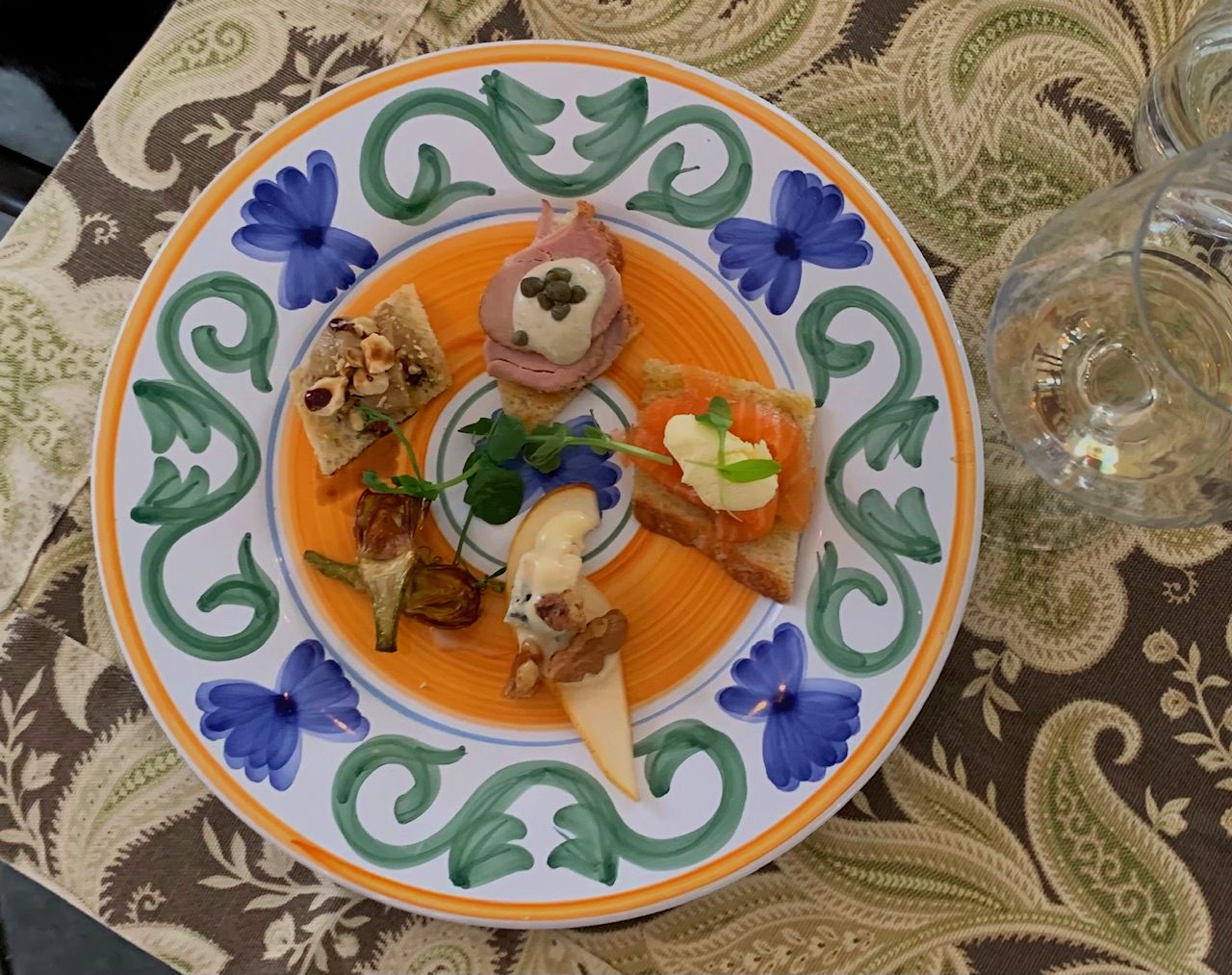 Mixed appetizers with a glass of wine